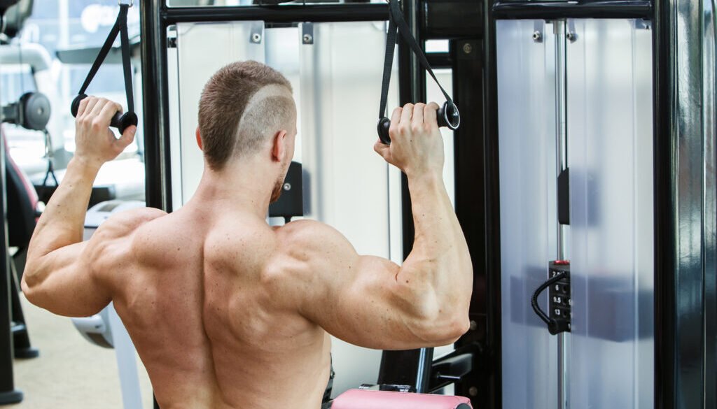Gym. Handsome man during workout